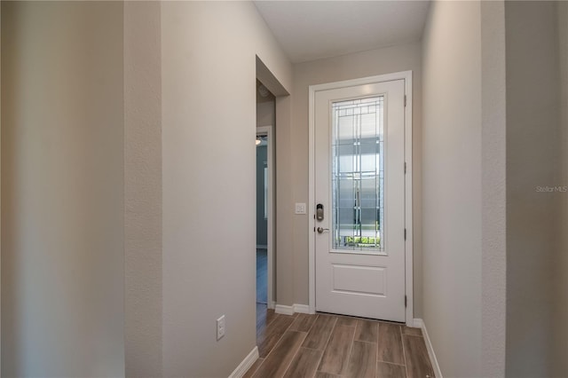 doorway with hardwood / wood-style floors