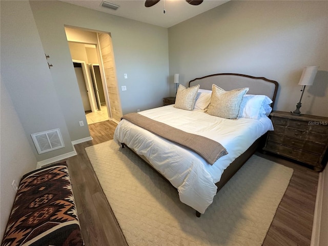 bedroom with ceiling fan and hardwood / wood-style flooring