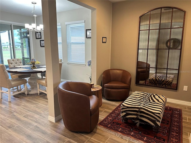 living area featuring a chandelier and wood-type flooring