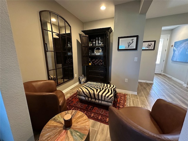 sitting room with light wood-type flooring