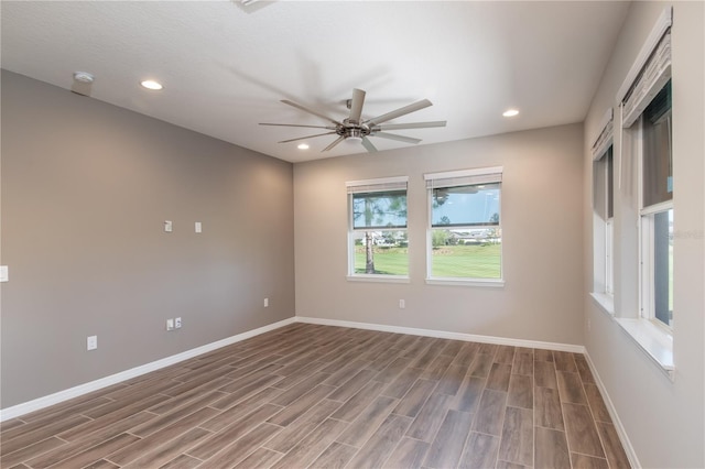 unfurnished room featuring hardwood / wood-style floors and ceiling fan