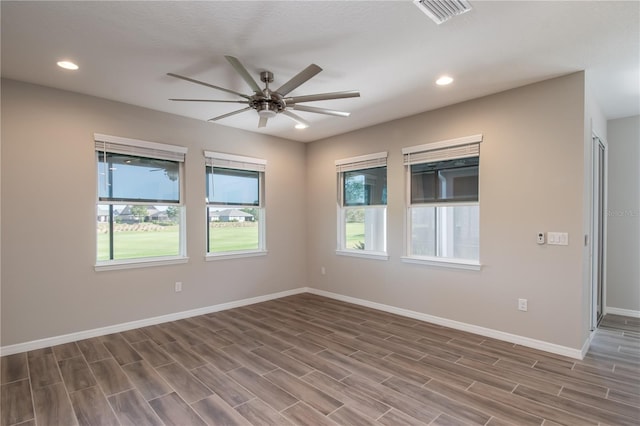 unfurnished room with wood-type flooring and ceiling fan