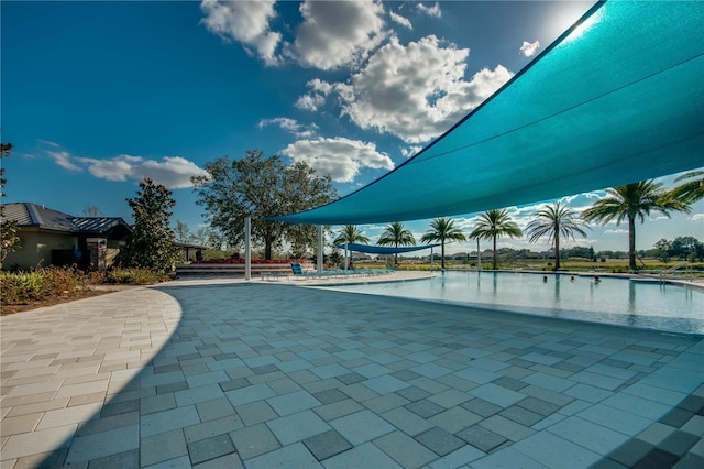 view of swimming pool with a water view