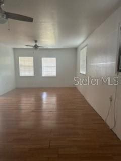 unfurnished room featuring ceiling fan and wood-type flooring