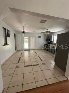 hallway with light tile floors