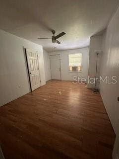 unfurnished bedroom featuring ceiling fan and wood-type flooring