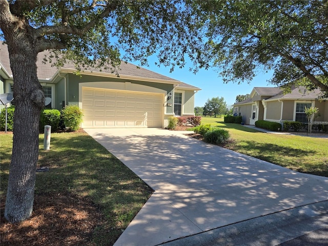 single story home featuring a garage and a front yard