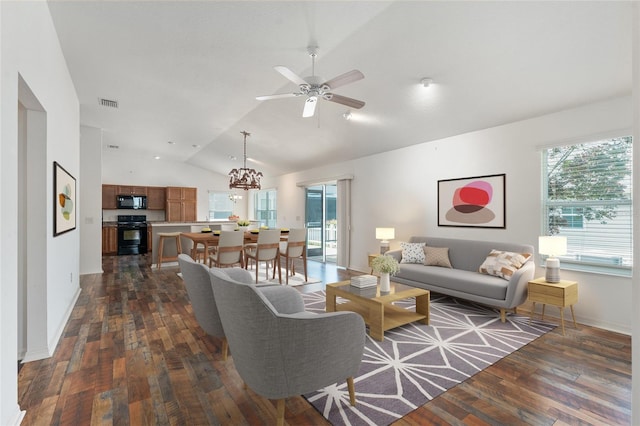 living room featuring ceiling fan with notable chandelier, dark wood-type flooring, and lofted ceiling