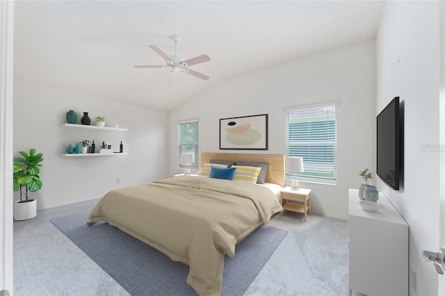 carpeted bedroom featuring ceiling fan and lofted ceiling