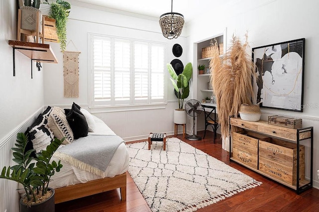 sitting room with dark hardwood / wood-style flooring and an inviting chandelier