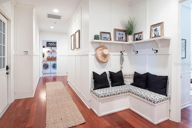 mudroom featuring hardwood / wood-style flooring and washing machine and clothes dryer