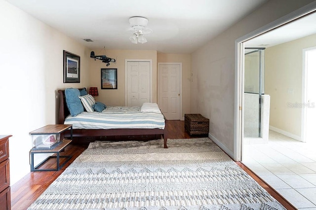 bedroom with ceiling fan and light hardwood / wood-style floors