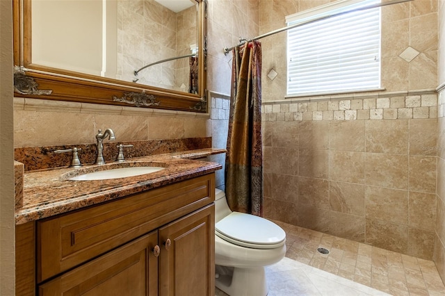 bathroom featuring vanity, a shower with shower curtain, and toilet