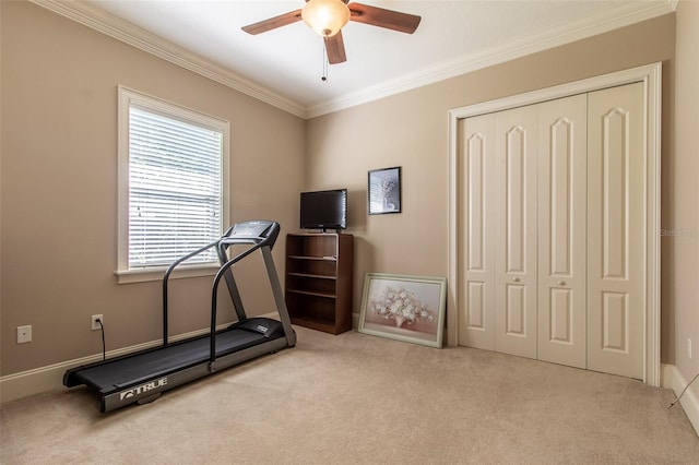 exercise room with light carpet, ceiling fan, and crown molding