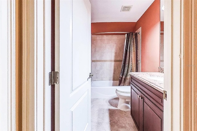 full bathroom featuring shower / tub combo, vanity, and toilet