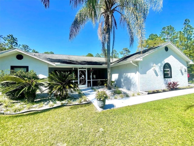 ranch-style home featuring a front yard