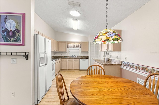 kitchen with light brown cabinets, sink, lofted ceiling, white appliances, and light wood-type flooring