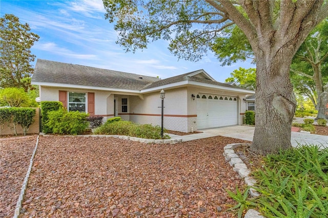 ranch-style house featuring a garage