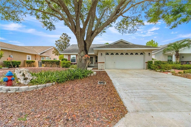 ranch-style home featuring a garage