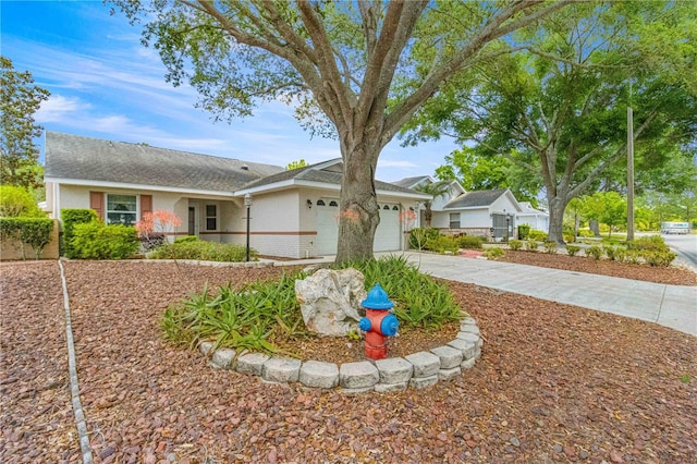 ranch-style home with a garage