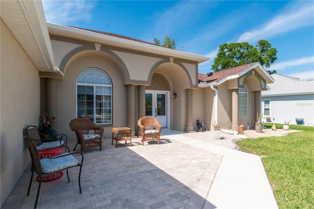 back of house featuring a patio area and outdoor lounge area