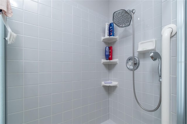 bathroom with a tile shower