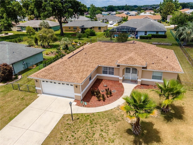 view of front of home featuring a garage and a front yard