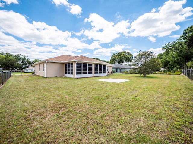 view of yard featuring a sunroom