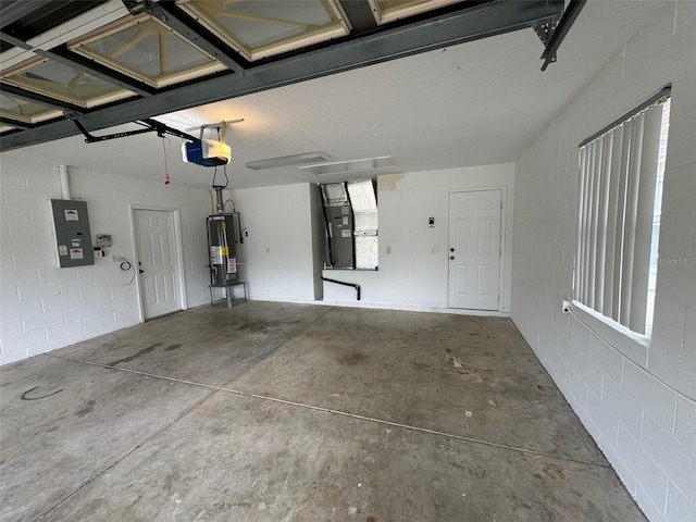 garage with heating unit, electric panel, a garage door opener, and gas water heater