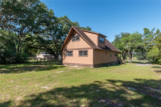 view of home's exterior featuring a lawn