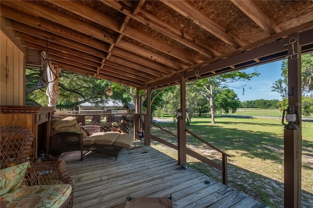 wooden terrace with a lawn