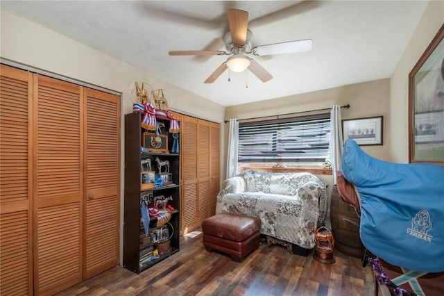 sitting room featuring dark hardwood / wood-style flooring and ceiling fan