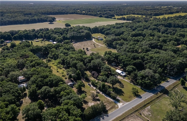 birds eye view of property with a rural view