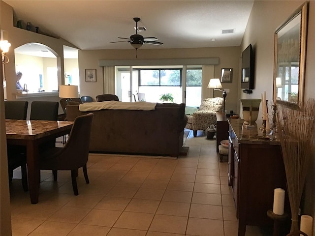 living room featuring tile flooring and ceiling fan