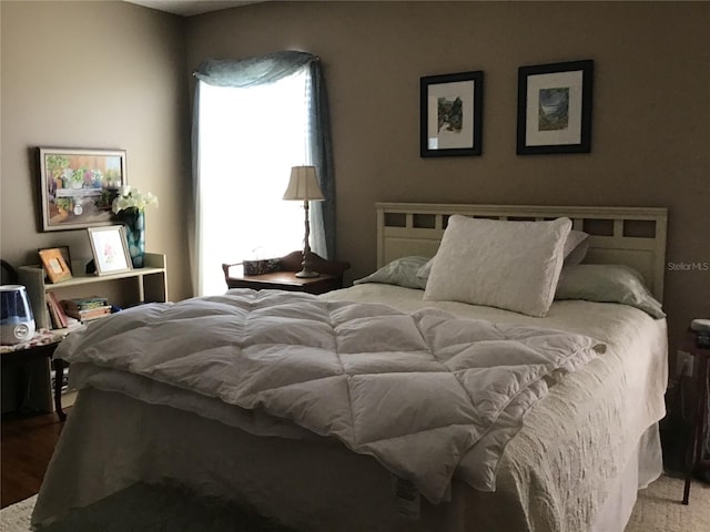 bedroom featuring wood-type flooring