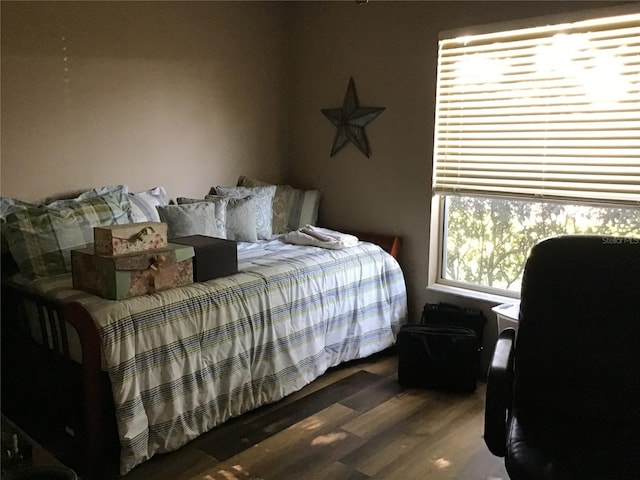 bedroom with hardwood / wood-style floors