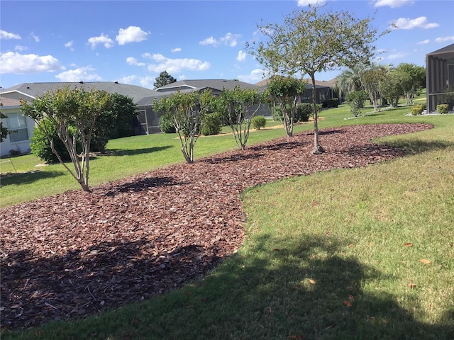 view of property's community with a yard