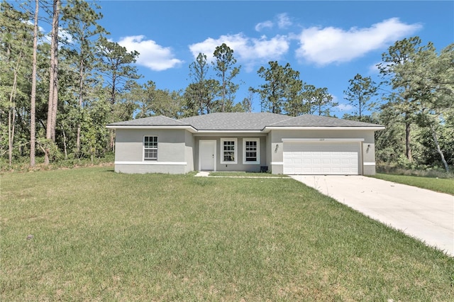 view of front facade featuring a garage and a front lawn