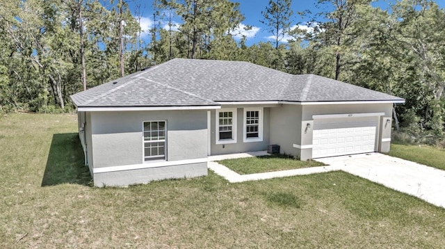 ranch-style house featuring a front yard, a garage, and central AC unit