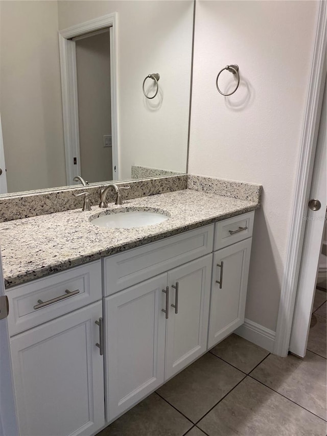 bathroom featuring oversized vanity and tile flooring