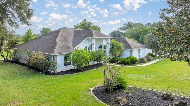 view of side of home featuring a yard