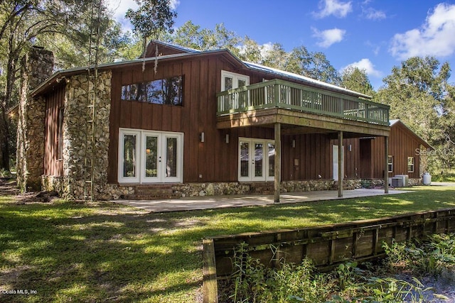 back of house with french doors, a yard, cooling unit, and a patio area