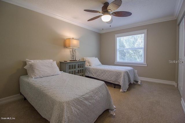 carpeted bedroom with ceiling fan and ornamental molding