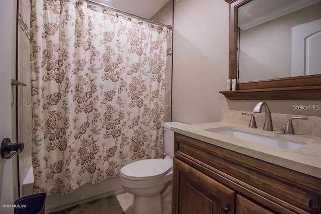 bathroom with vanity, ornamental molding, and toilet