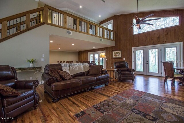 living room with hardwood / wood-style floors, ceiling fan, a healthy amount of sunlight, and french doors