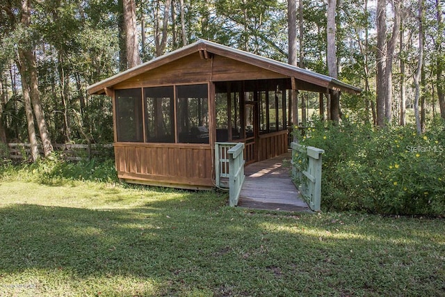 view of outdoor structure featuring a yard