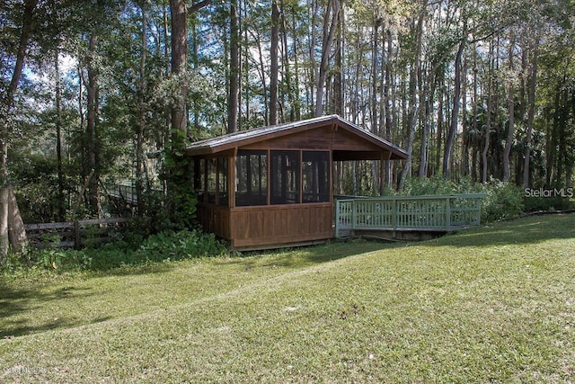 view of yard featuring a sunroom