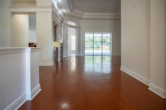 empty room featuring dark hardwood / wood-style flooring and a high ceiling