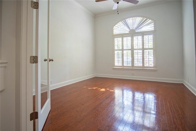 empty room with ceiling fan, crown molding, french doors, and dark wood-type flooring