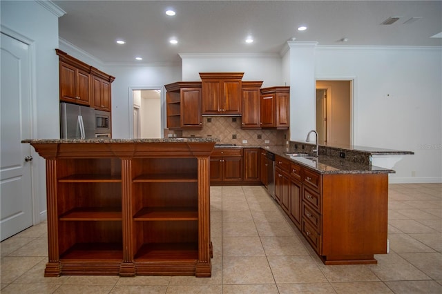 kitchen featuring light tile flooring, crown molding, kitchen peninsula, stainless steel appliances, and dark stone counters